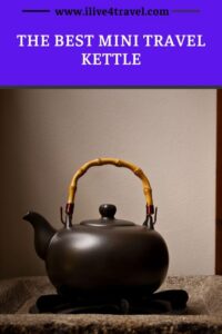 a pin created by i live for travel about the best travel kettle showing a black metal kettle with a wooden handle stood on a stone bench