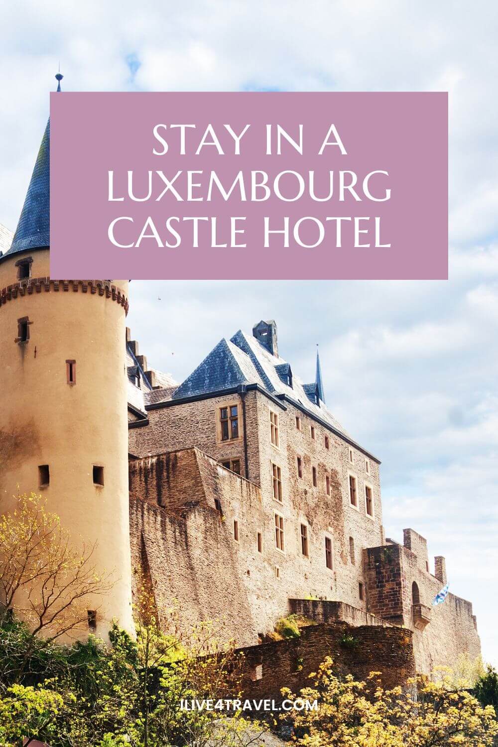 a pin created by i live for travel about staying in a luxembourg castle hotel, showing a castle with straight walls and a roof and a round turret to the left and yellow flowers on branches below the castle