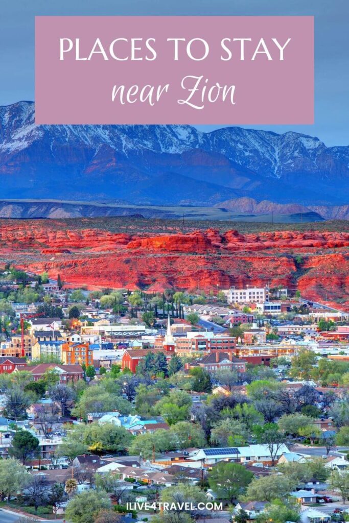 a pinterest pin about places to stay near zion, showing a town with a lot of trees in it, surrounded by orange hills and in the background mountains with snow on them