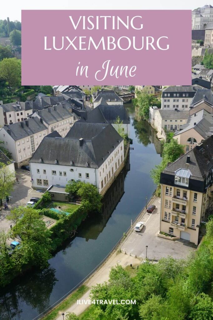 a pinterest pin about visiting luxembourg in june showing houses along a river in a valley