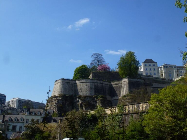 the walls of the castle around the cliffs of Luxembourg City with buildings on the top