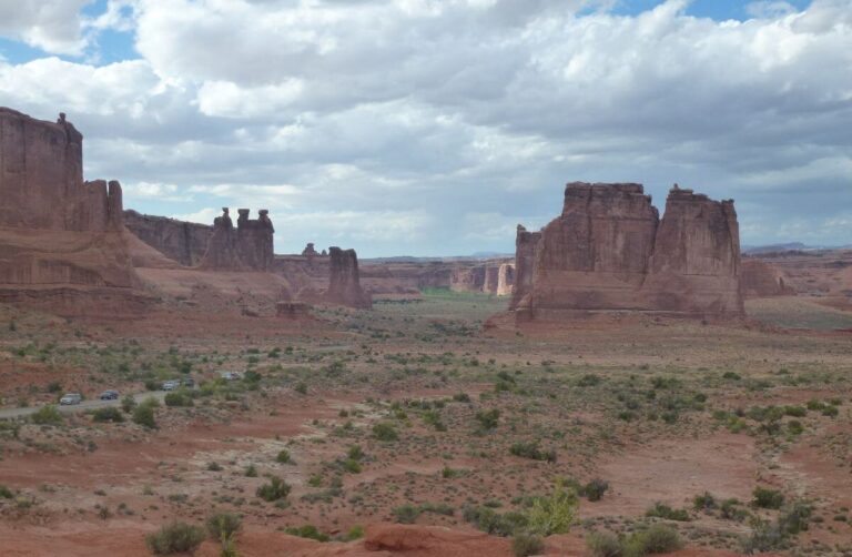 a valley with large worn away rocks in the middle of it