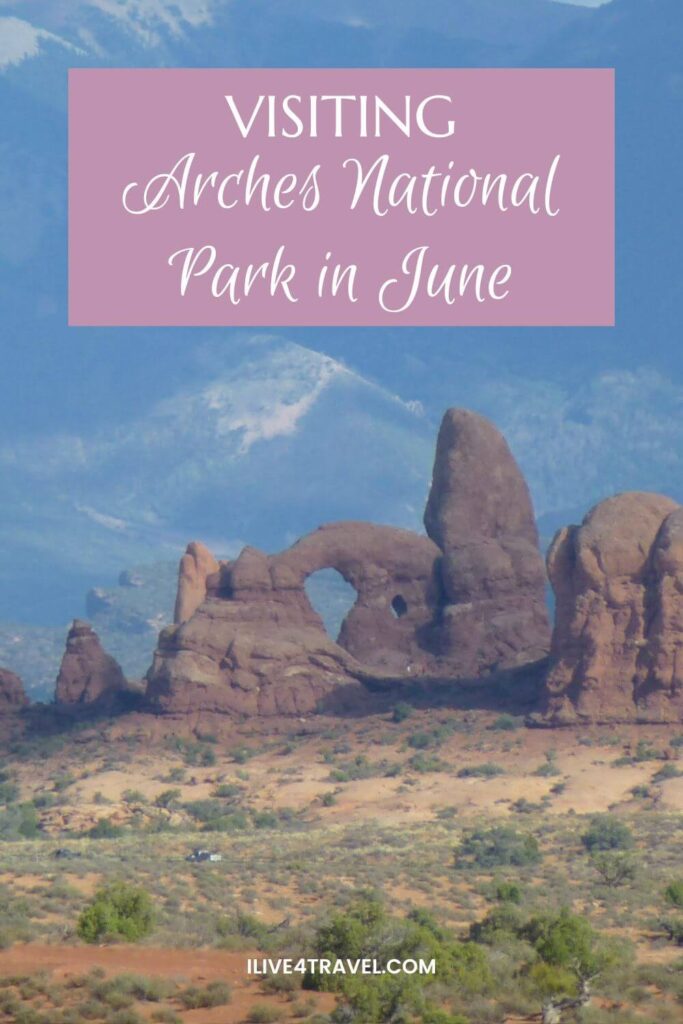 a pinterest pin about visiting arches national park in june with an image of large orange rocks with holes in them, but bushes and trees on the ground and mountains in the background