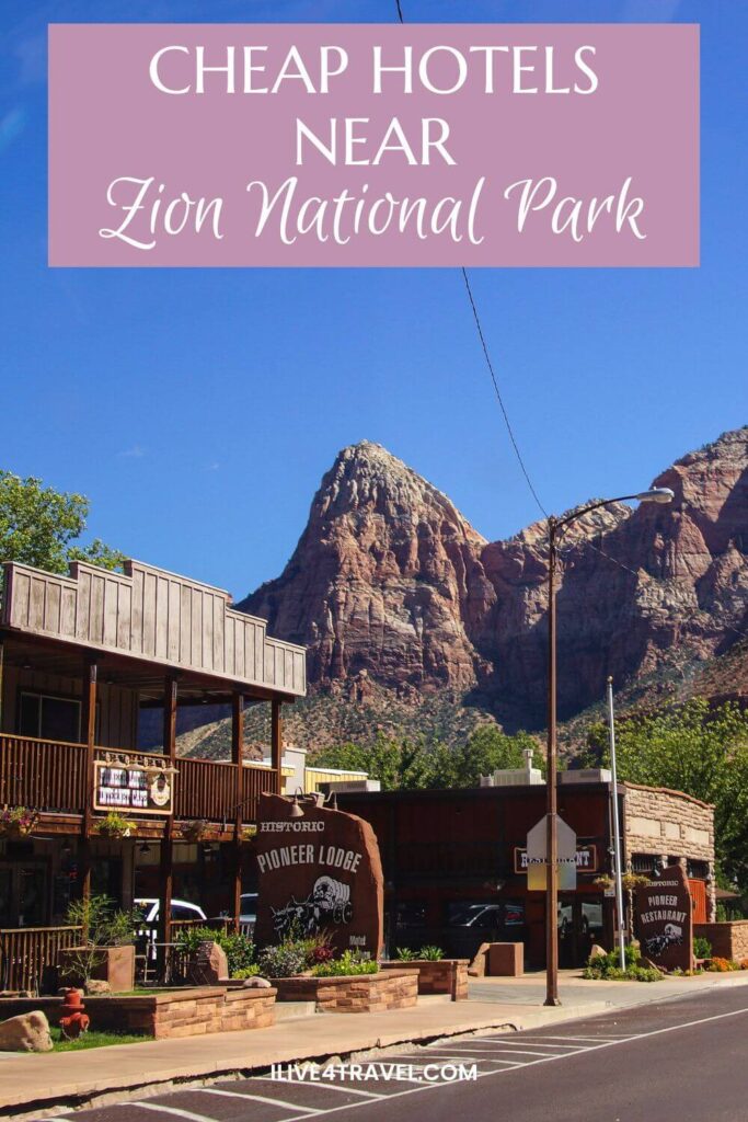 a pinterest pin about cheap hotels near zion national park showing a wooden built hotel and restaurant alongside a road with orange and white canyon sides in the background