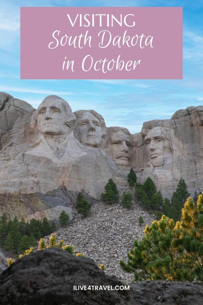 a pinterest pin about visiting south dakota in october, showing four faces carved into the side of a mountain with a few trees below them.